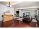 Living room with hardwood floors, fireplace, and bar area at 1654 S Perry St, Denver, CO 80219