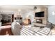 Spacious living room with a fireplace and hardwood floors at 1654 S Perry St, Denver, CO 80219