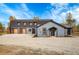 House exterior with attached garage at 14405 County Road 12, Fort Lupton, CO 80621