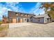Modern farmhouse exterior with attached garage at 14405 County Road 12, Fort Lupton, CO 80621