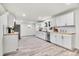 Modern kitchen with white cabinets and butcher block counters at 14405 County Road 12, Fort Lupton, CO 80621