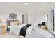 Bright bedroom with a queen bed and large closet at 14405 County Road 12, Fort Lupton, CO 80621