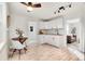 Charming kitchen with white shaker cabinets and a breakfast nook at 14405 County Road 12, Fort Lupton, CO 80621