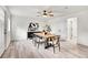 Bright dining room featuring a wood table and six chairs at 14405 County Road 12, Fort Lupton, CO 80621