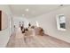 Relaxing Gathering room with a comfortable sofa and plenty of natural light at 14405 County Road 12, Fort Lupton, CO 80621