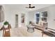 Cozy living room with a comfortable sofa and large windows at 14405 County Road 12, Fort Lupton, CO 80621