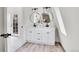 Elegant bathroom with a double vanity and walk-in shower at 14405 County Road 12, Fort Lupton, CO 80621