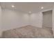 Spacious finished basement with neutral carpet and recessed lighting at 8665 Middle Fork St, Littleton, CO 80125