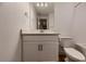 Basement bathroom with white vanity and a tub at 8665 Middle Fork St, Littleton, CO 80125