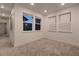 Bright hallway with carpet and access to bedrooms at 8665 Middle Fork St, Littleton, CO 80125