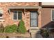 Brick front exterior with a covered entryway at 9131 E Mansfield Ave, Denver, CO 80237