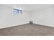 Spacious finished basement bedroom with neutral carpeting and large window at 3939 S Huron St, Englewood, CO 80110