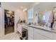 Double vanity bathroom with granite countertop and walk-in shower at 39286 Hart Cir, Elizabeth, CO 80107