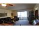 Spacious living room with sliding glass doors leading to a balcony at 13901 E Marina Dr # 308, Aurora, CO 80014