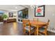 Mid-century modern dining area with hardwood floors and large windows at 6780 S Grant St, Centennial, CO 80122