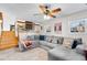 Living room with sectional sofa, fireplace, and stairs at 18936 E Colorado Dr, Aurora, CO 80017
