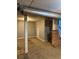 Unfinished basement area with neutral walls and carpeted floor at 1860 S Dahlia St, Denver, CO 80222