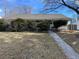Ranch-style home exterior with landscaping and walkway at 1860 S Dahlia St, Denver, CO 80222