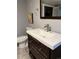 Basement bathroom with toilet and vanity with drawers at 1860 S Dahlia St, Denver, CO 80222