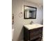 Basement bathroom with vanity, mirror, and tiled floor at 1860 S Dahlia St, Denver, CO 80222