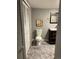 Basement bathroom with toilet, vanity, and tiled floor at 1860 S Dahlia St, Denver, CO 80222