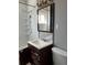 Clean bathroom featuring a vanity with drawers and a large mirror at 1860 S Dahlia St, Denver, CO 80222
