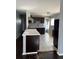 Kitchen with dark cabinets and tile backsplash at 1860 S Dahlia St, Denver, CO 80222