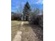 Large backyard with shed and pathway at 1860 S Dahlia St, Denver, CO 80222