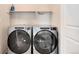 Modern laundry room with washer and dryer at 12772 Boggs St, Parker, CO 80134