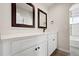 Updated bathroom with double vanity and modern fixtures at 1543 Feltham Pl, Longmont, CO 80501