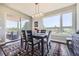Elegant dining room with access to a deck overlooking a golf course at 4673 W 50Th Pl, Denver, CO 80212