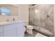 Modern bathroom with a large shower and white vanity at 4673 W 50Th Pl, Denver, CO 80212