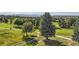 Stunning aerial view of the property and surrounding golf course at 4673 W 50Th Pl, Denver, CO 80212