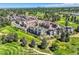 Bird's-eye view of community near golf course and city skyline at 4673 W 50Th Pl, Denver, CO 80212