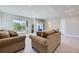 Finished basement with couches, access to patio, and gym at 4673 W 50Th Pl, Denver, CO 80212