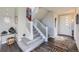 Bright entryway with hardwood floors, staircase, and modern decor at 4673 W 50Th Pl, Denver, CO 80212