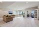 Finished basement with couches, access to patio, and gym at 4673 W 50Th Pl, Denver, CO 80212