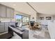 Game room with piano, wet bar, and sliding glass doors to deck at 4673 W 50Th Pl, Denver, CO 80212