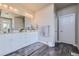 Elegant bathroom with double vanity, large mirror and modern fixtures at 4673 W 50Th Pl, Denver, CO 80212