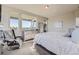 Serene bedroom with large windows offering scenic views and a relaxing sitting area at 4673 W 50Th Pl, Denver, CO 80212