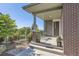 Brick front porch with seating area and modern front door at 4673 W 50Th Pl, Denver, CO 80212