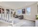 Spacious upper landing with sitting area and stairway at 4673 W 50Th Pl, Denver, CO 80212