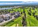 Aerial view of community near golf course and lake at 4673 W 50Th Pl, Denver, CO 80212