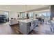 Open concept kitchen with a large island and hardwood floors at 4673 W 50Th Pl, Denver, CO 80212