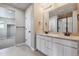 Elegant bathroom with double vanity and walk-in shower at 9998 Racine St, Commerce City, CO 80022