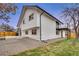 Modern house exterior with a clean white finish and balcony at 7234 Eaton Cir, Arvada, CO 80003