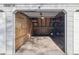 Interior of a garage with unfinished walls and storage space at 11895 E Cornell Circle, Aurora, CO 80014