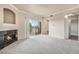 Spacious living room with fireplace and access to balcony at 1801 S Dunkirk St # 303, Aurora, CO 80017