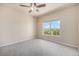 Spacious bedroom with large window and gray carpeting at 1801 S Dunkirk St # 303, Aurora, CO 80017