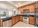 Modern kitchen with stainless steel appliances and granite countertops at 1801 S Dunkirk St # 303, Aurora, CO 80017